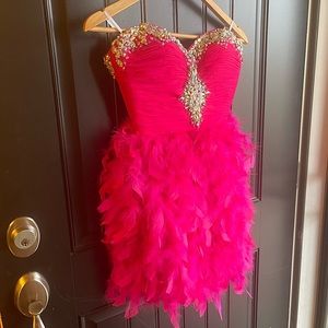 Pink cocktail dress with feathers